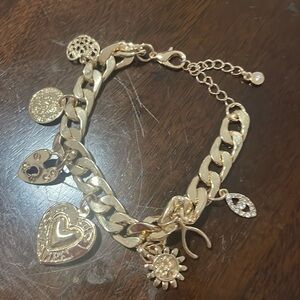 Golden bracelets with charms